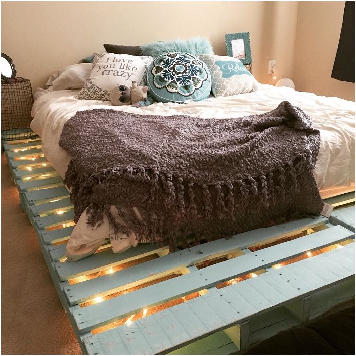 Delicate pastel turquoise bed frame with lights creates an incredible feeling of comfort in the room.