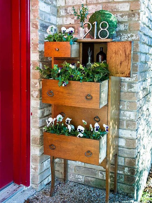 An antique chest of drawers has become a great place to hide flowers in it.