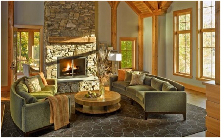 Cozy room with stone floor and fireplace and wood trim.