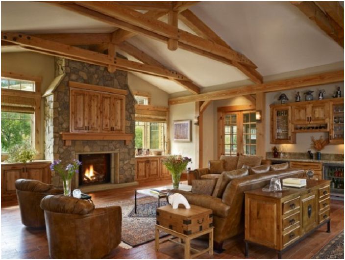 Combination of wooden furniture with a stone fireplace and an excellent view from the window.