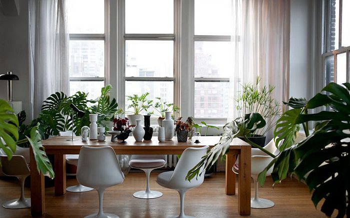 Luxurious modern industrial dining room by Studio Recreation Inc